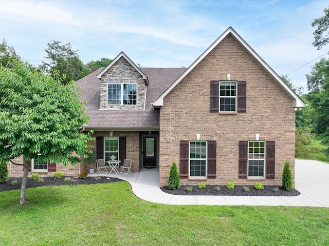 1116 Rivercrest Dr, Murfreesboro, TN 37129 - view of front of property featuring a front lawn, a shingled roof, and brick siding