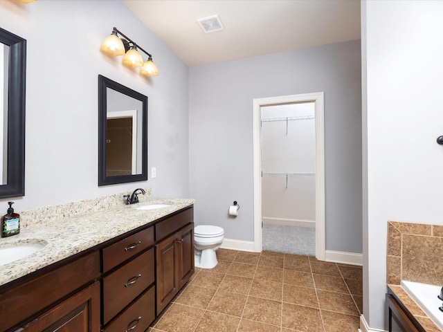 1116 Rivercrest Dr, Murfreesboro, TN 37129 - bathroom featuring a garden tub, double vanity, baseboards, and toilet