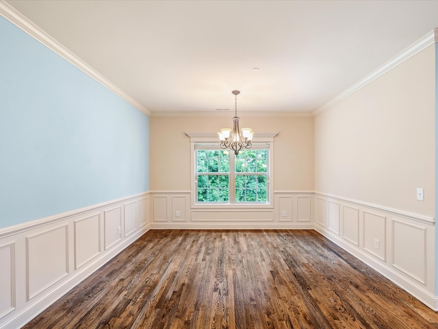 1116 Rivercrest Dr, Murfreesboro, TN 37129 - empty room featuring a chandelier, dark wood-style floors, a wainscoted wall, crown molding, and a decorative wall