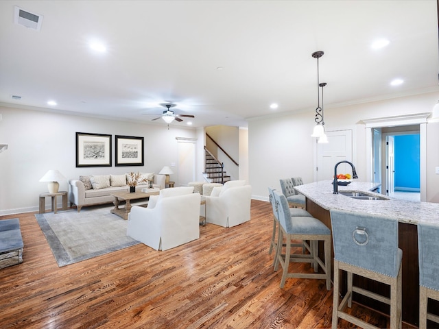 1116 Rivercrest Dr, Murfreesboro, TN 37129 - living area with ceiling fan, stairway, ornamental molding, wood finished floors, and recessed lighting