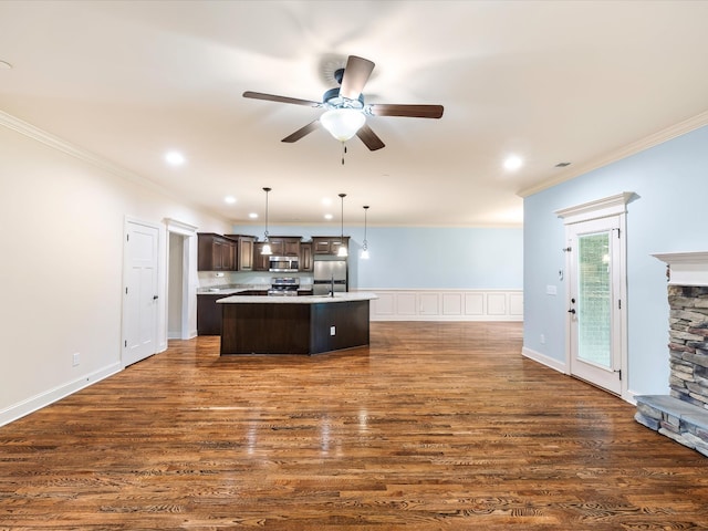 1116 Rivercrest Dr, Murfreesboro, TN 37129 - kitchen with appliances with stainless steel finishes, dark brown cabinets, crown molding, light countertops, and ceiling fan