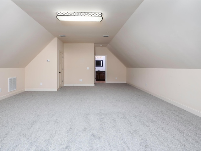 1116 Rivercrest Dr, Murfreesboro, TN 37129 - bonus room featuring lofted ceiling, light carpet, and baseboards