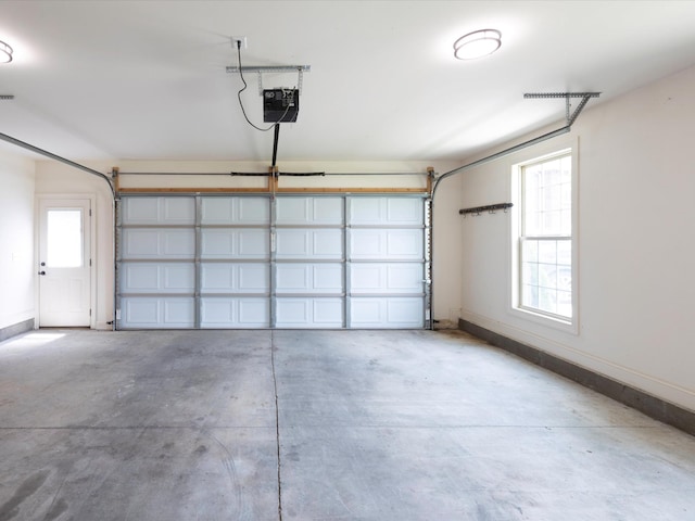 1116 Rivercrest Dr, Murfreesboro, TN 37129 - garage featuring a garage door opener and baseboards