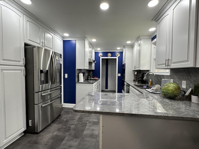 2364 Skyview Dr, Centerville, TN 37033 - kitchen with stainless steel fridge with ice dispenser, a sink, white cabinetry, a peninsula, and recessed lighting