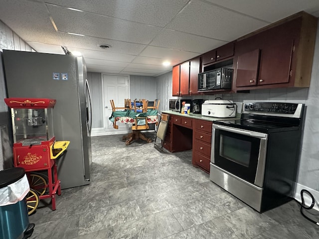 2364 Skyview Dr, Centerville, TN 37033 - kitchen featuring appliances with stainless steel finishes, a paneled ceiling, and light countertops
