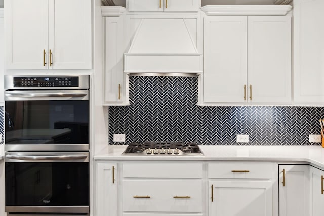 4337 Peacemill Ln, Murfreesboro, TN 37128 - kitchen featuring stainless steel appliances, custom exhaust hood, white cabinetry, and light countertops