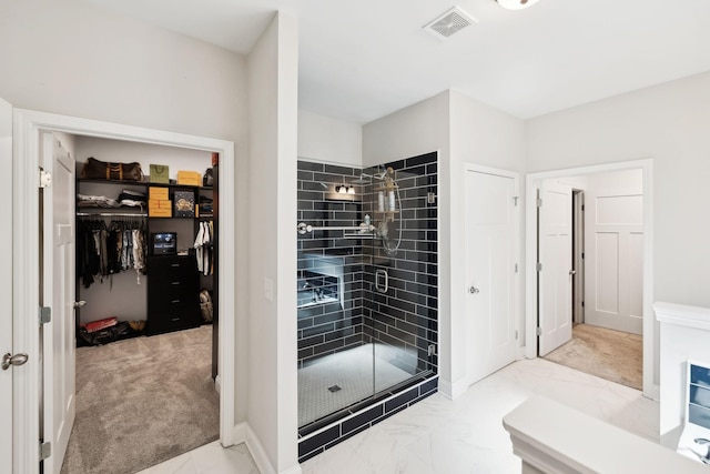 4337 Peacemill Ln, Murfreesboro, TN 37128 - bathroom with a stall shower, marble look tile flooring, a spacious closet, and baseboards