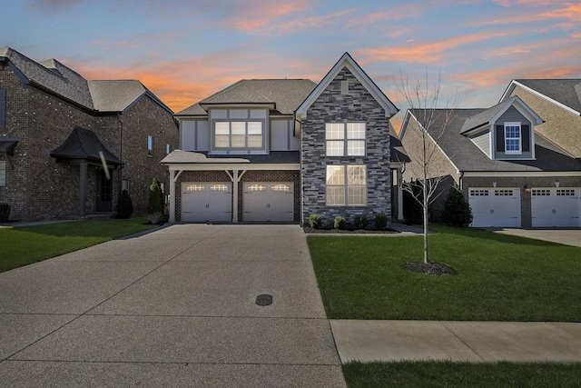 4337 Peacemill Ln, Murfreesboro, TN 37128 - view of front of house with concrete driveway, a garage, a yard, and stone siding