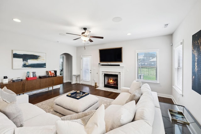 4337 Peacemill Ln, Murfreesboro, TN 37128 - living area featuring arched walkways, a ceiling fan, dark wood-style flooring, a fireplace, and recessed lighting