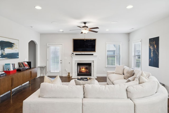 4337 Peacemill Ln, Murfreesboro, TN 37128 - living room featuring ceiling fan, dark wood-style floors, recessed lighting, a premium fireplace, and arched walkways