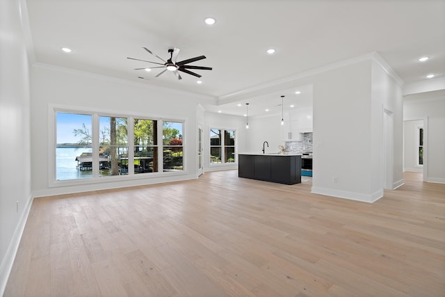 199 Beach Rd N, Killen, AL 35645 - unfurnished living room with ornamental molding, recessed lighting, light wood-style flooring, a ceiling fan, and baseboards