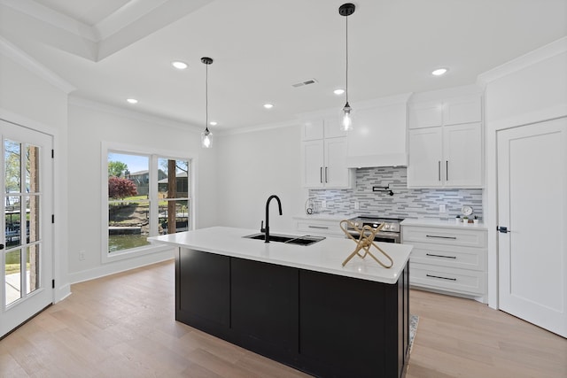 199 Beach Rd N, Killen, AL 35645 - kitchen featuring a sink, stainless steel electric stove, backsplash, light wood-type flooring, and light countertops