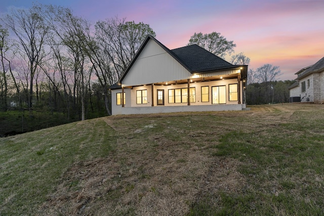 199 Beach Rd N, Killen, AL 35645 - back of house at dusk with a yard and cooling unit