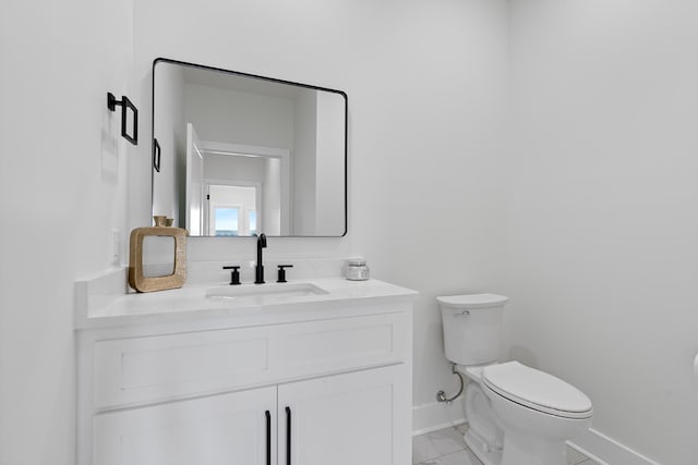 199 Beach Rd N, Killen, AL 35645 - half bath featuring toilet, baseboards, vanity, and marble look tile flooring