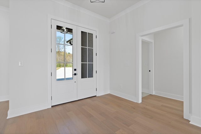 199 Beach Rd N, Killen, AL 35645 - doorway to outside featuring light wood finished floors, ornamental molding, and baseboards