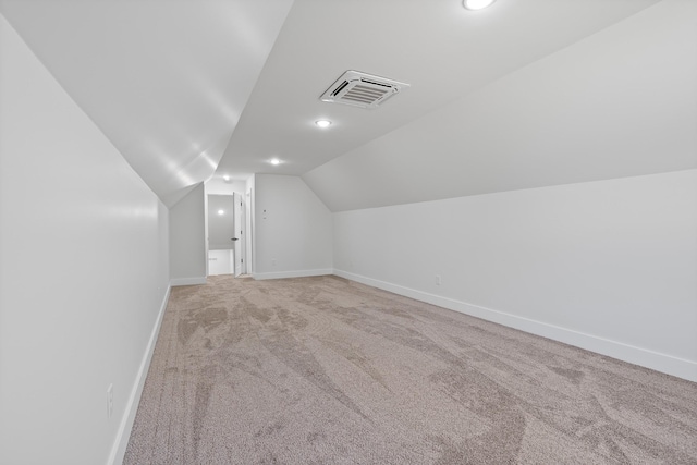 199 Beach Rd N, Killen, AL 35645 - bonus room featuring light carpet, baseboards, vaulted ceiling, and recessed lighting
