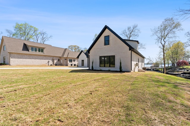 199 Beach Rd N, Killen, AL 35645 - rear view of house featuring a yard