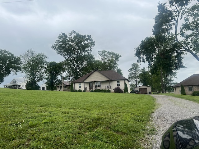 460 Armstrong Rd, Castalian Springs, TN 37031 - ranch-style house featuring a front lawn and an outbuilding