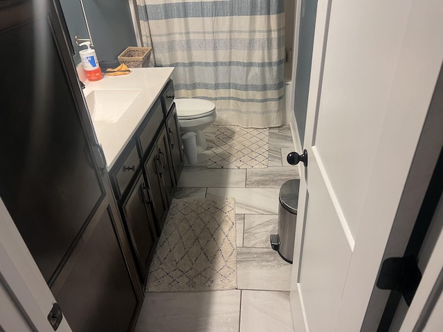460 Armstrong Rd, Castalian Springs, TN 37031 - bathroom featuring toilet, vanity, a shower with curtain, and marble look tile flooring