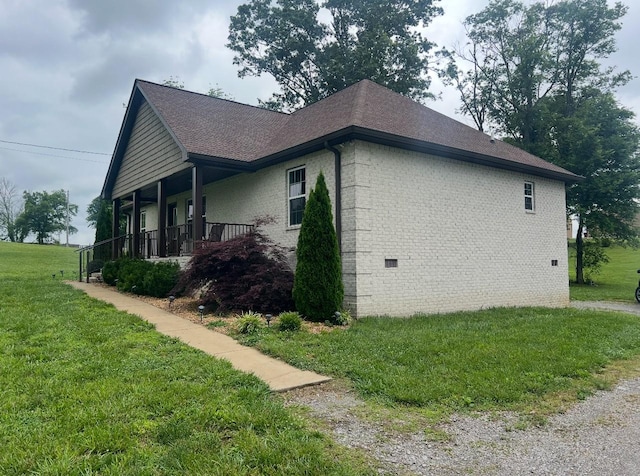 460 Armstrong Rd, Castalian Springs, TN 37031 - view of property exterior featuring a yard, brick siding, a shingled roof, and a porch