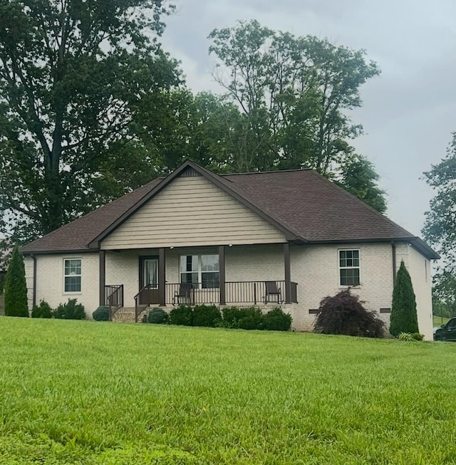 460 Armstrong Rd, Castalian Springs, TN 37031 - view of front of property with covered porch, a front lawn, and a shingled roof