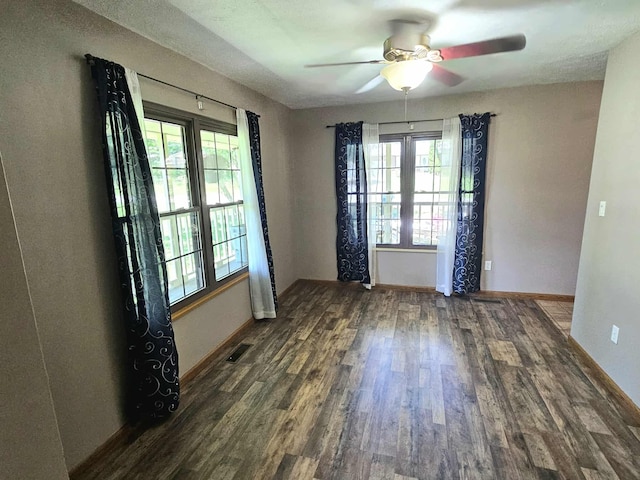 102 Hazelnut Ave, Camden, TN 38320 - spare room with wood finished floors, ceiling fan, healthy amount of natural light, and baseboards