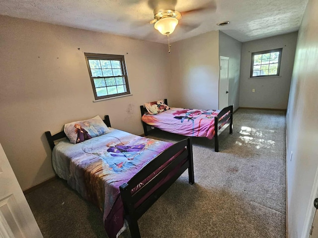 102 Hazelnut Ave, Camden, TN 38320 - bedroom featuring carpet, baseboards, ceiling fan, and a textured ceiling