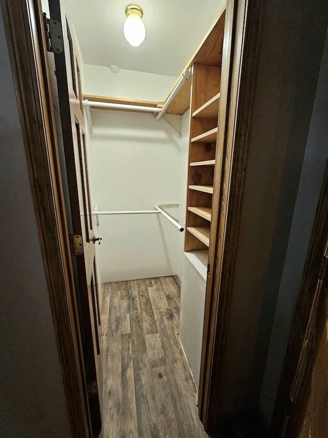 102 Hazelnut Ave, Camden, TN 38320 - spacious closet with dark wood-type flooring