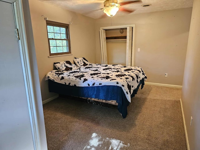 102 Hazelnut Ave, Camden, TN 38320 - bedroom with carpet flooring, baseboards, a closet, and a ceiling fan