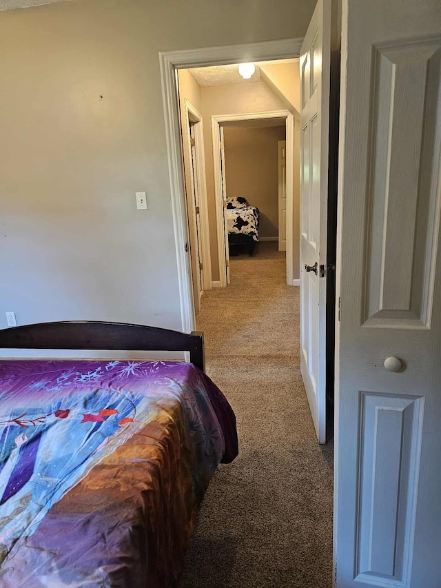 102 Hazelnut Ave, Camden, TN 38320 - carpeted bedroom with baseboards
