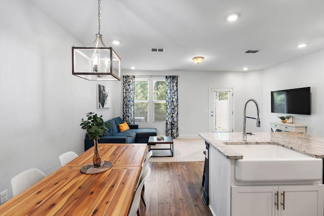 2717 Gossett Trl, Nashville, TN 37221 - kitchen featuring a sink, open floor plan, recessed lighting, dark wood-style floors, and hanging light fixtures