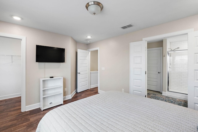 2717 Gossett Trl, Nashville, TN 37221 - bedroom featuring a walk in closet, baseboards, dark wood finished floors, a closet, and ensuite bath