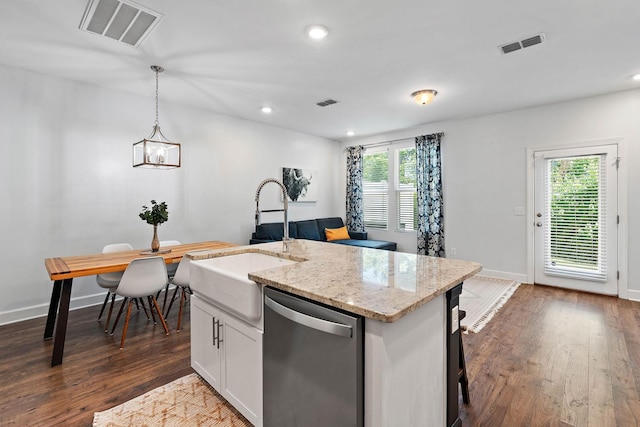 2717 Gossett Trl, Nashville, TN 37221 - kitchen featuring stainless steel dishwasher, a sink, dark wood finished floors, pendant lighting, and white cabinetry