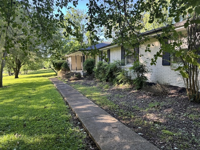 512 Utley Dr, Goodlettsville, TN 37072 - view of side of property with brick siding and a yard