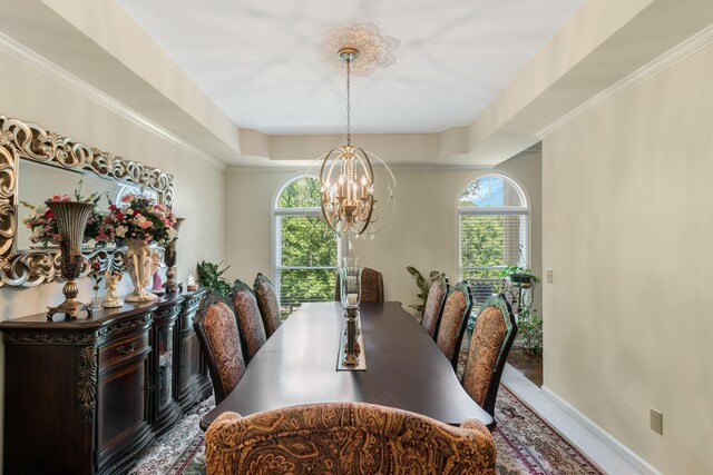 3871 Stevens Ln, Nashville, TN 37218 - dining area with a chandelier, a tray ceiling, and baseboards