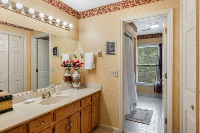 3871 Stevens Ln, Nashville, TN 37218 - full bath featuring wallpapered walls, vanity, tile patterned flooring, and baseboards