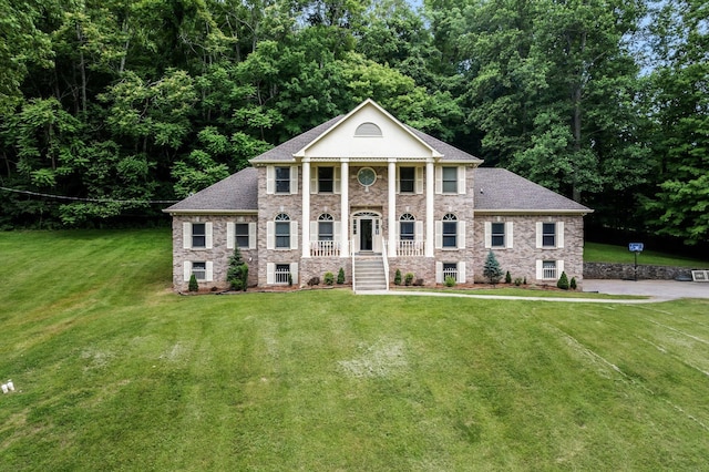 3871 Stevens Ln, Nashville, TN 37218 - neoclassical home featuring a front yard and roof with shingles