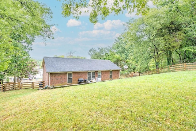 102 Mckinley Dr, Columbia, TN 38401 - back of house featuring brick siding and a shingled roof