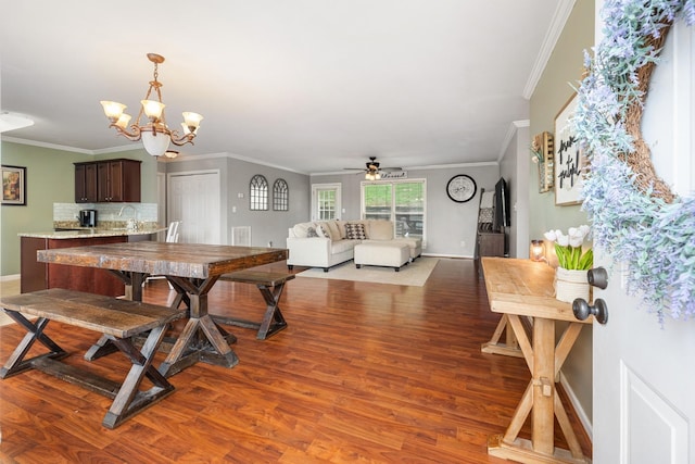 102 Mckinley Dr, Columbia, TN 38401 - dining space with a chandelier, crown molding, wood finished floors, ceiling fan, and baseboards