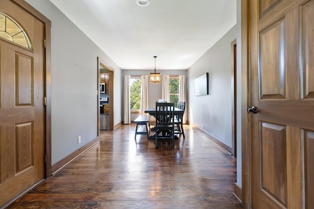 2890 Ellis Ln, Palmyra, TN 37142 - dining room with dark wood-type flooring, baseboards, and a chandelier