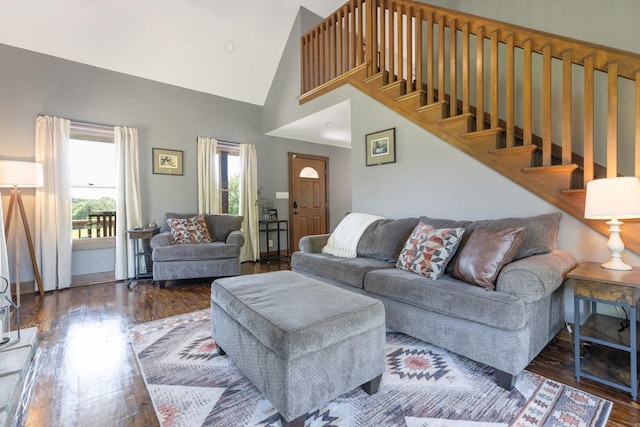 2890 Ellis Ln, Palmyra, TN 37142 - living area with wood finished floors, high vaulted ceiling, and stairs