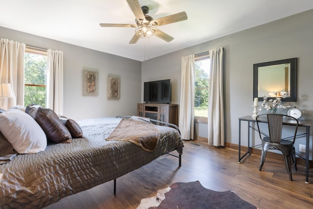 2890 Ellis Ln, Palmyra, TN 37142 - bedroom featuring multiple windows, wood finished floors, and a ceiling fan