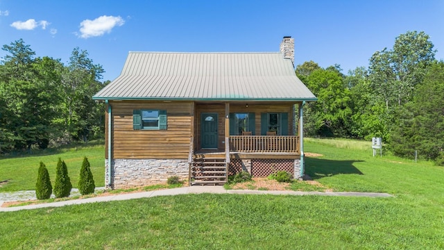 2890 Ellis Ln, Palmyra, TN 37142 - view of front of home with a porch, stairway, a front yard, a chimney, and metal roof
