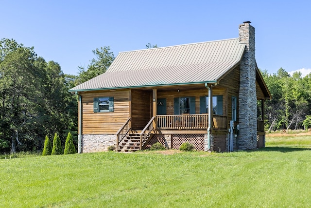 2890 Ellis Ln, Palmyra, TN 37142 - view of front of home with a porch, a front lawn, a chimney, and metal roof