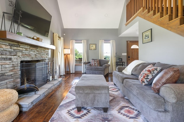 2890 Ellis Ln, Palmyra, TN 37142 - living area with high vaulted ceiling, wood finished floors, and a stone fireplace
