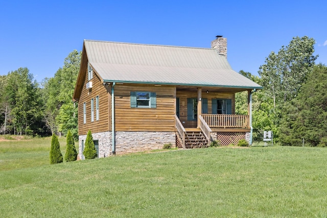 2890 Ellis Ln, Palmyra, TN 37142 - view of front of property featuring a chimney, a front yard, a porch, stairway, and stone siding