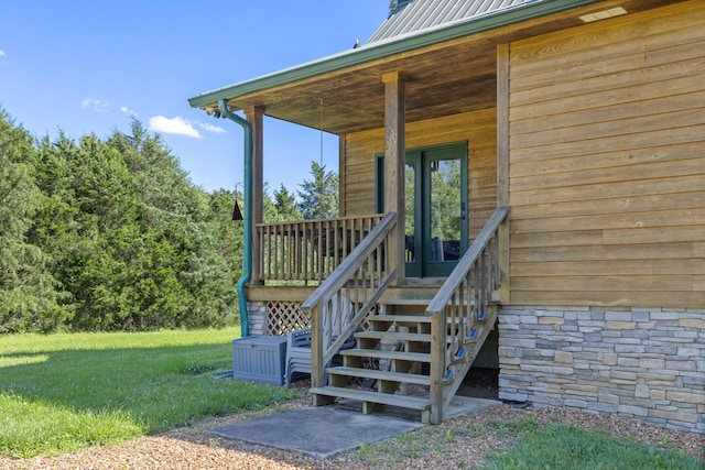 2890 Ellis Ln, Palmyra, TN 37142 - entrance to property featuring stone siding, metal roof, and a porch