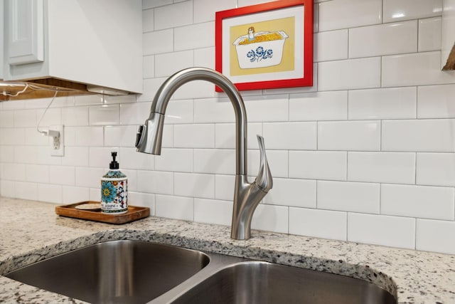 519 Glen Echo Dr, Old Hickory, TN 37138 - kitchen view of a sink, backsplash, and light stone countertops