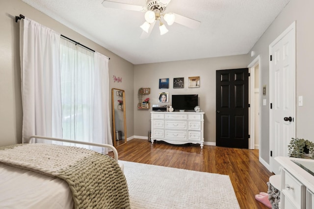 519 Glen Echo Dr, Old Hickory, TN 37138 - bedroom with dark wood-type flooring, baseboards, ceiling fan, and a textured ceiling