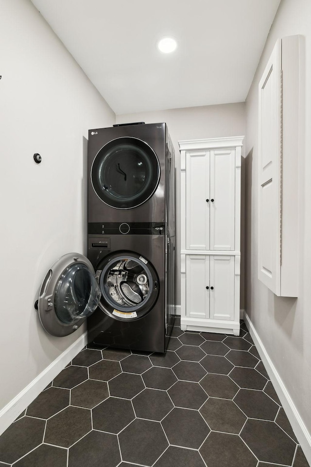 519 Glen Echo Dr, Old Hickory, TN 37138 - washroom with stacked washer / drying machine, cabinet space, baseboards, and recessed lighting